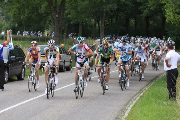 The peloton heads through the feed zone