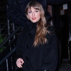 Taylor Swift was spotted in NYC wearing a grown-up, Louis Vuitton version of her beloved duffle coat with a matching bag