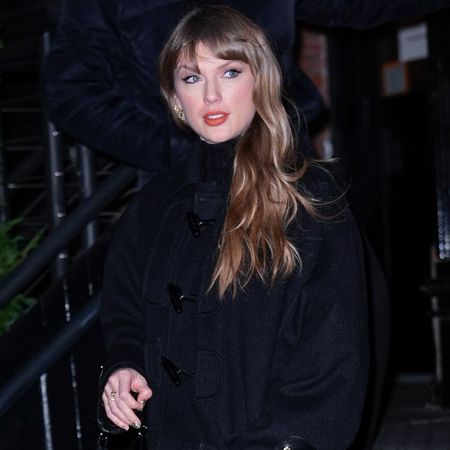 Taylor Swift was spotted in NYC wearing a grown-up, Louis Vuitton version of her beloved duffle coat with a matching bag