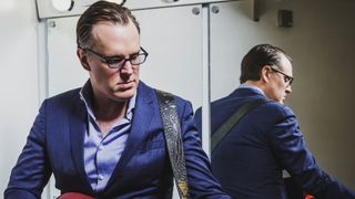 Portrait of American blues rock musician Joe Bonamassa, photographed before a live performance at Plymouth Pavilions in Devon, on March 21, 2016. 