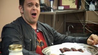 Adam Richman about to take on the Fire In Your Hole Wings challenge