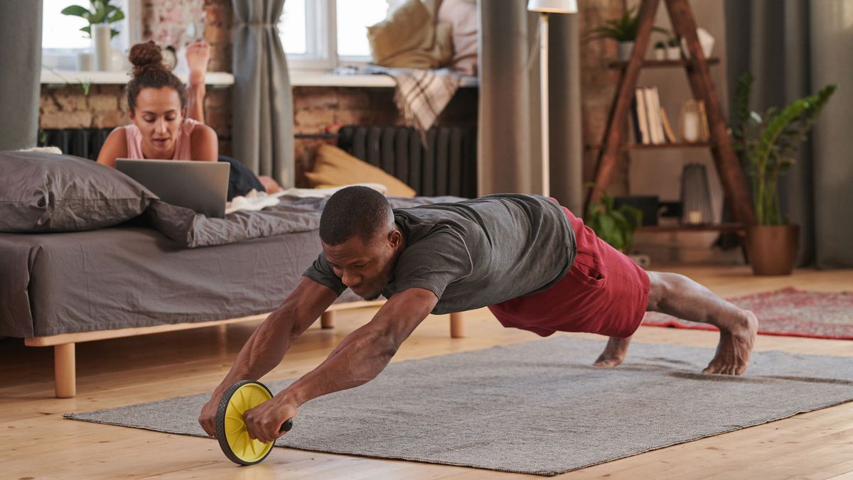 Man using an abs roller