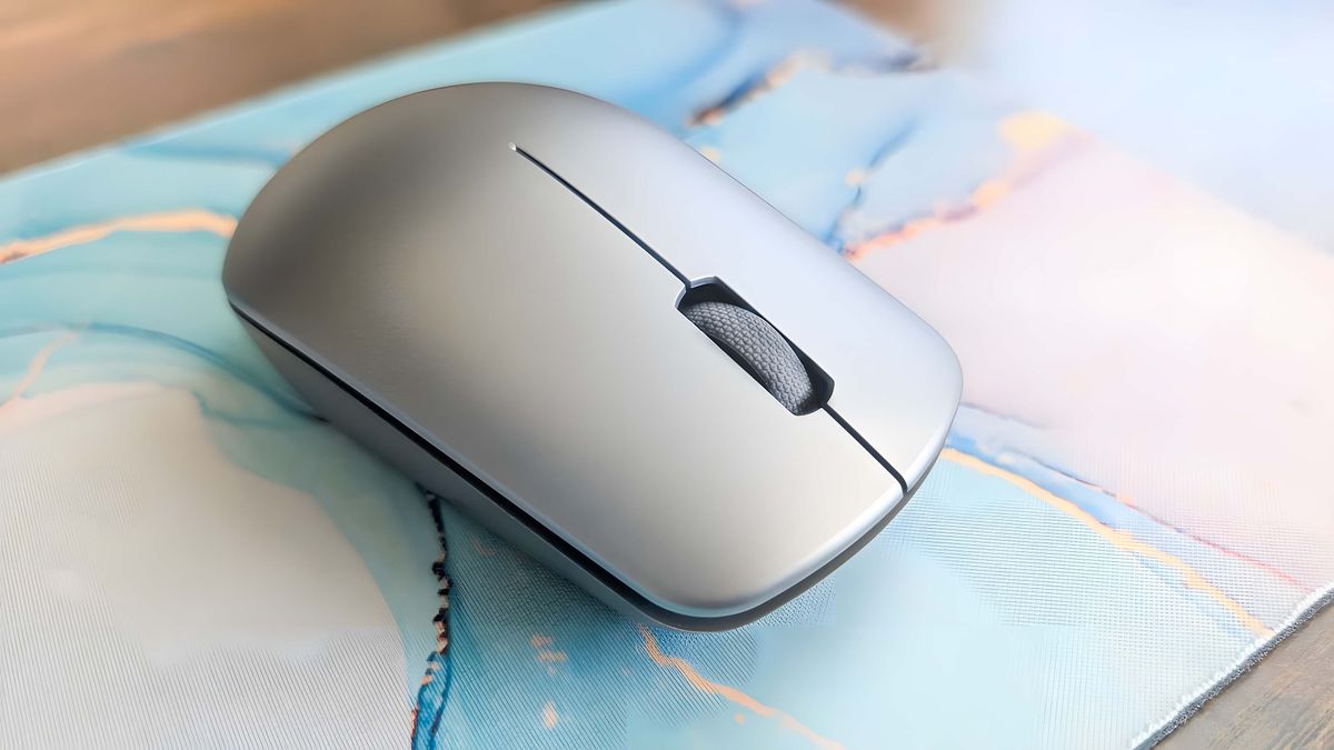 The mouse the comes with the Lenovo Yoga AIO 27" on a mousepad.