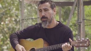 Serj Tankian performing solo acoustic track Artsakh
