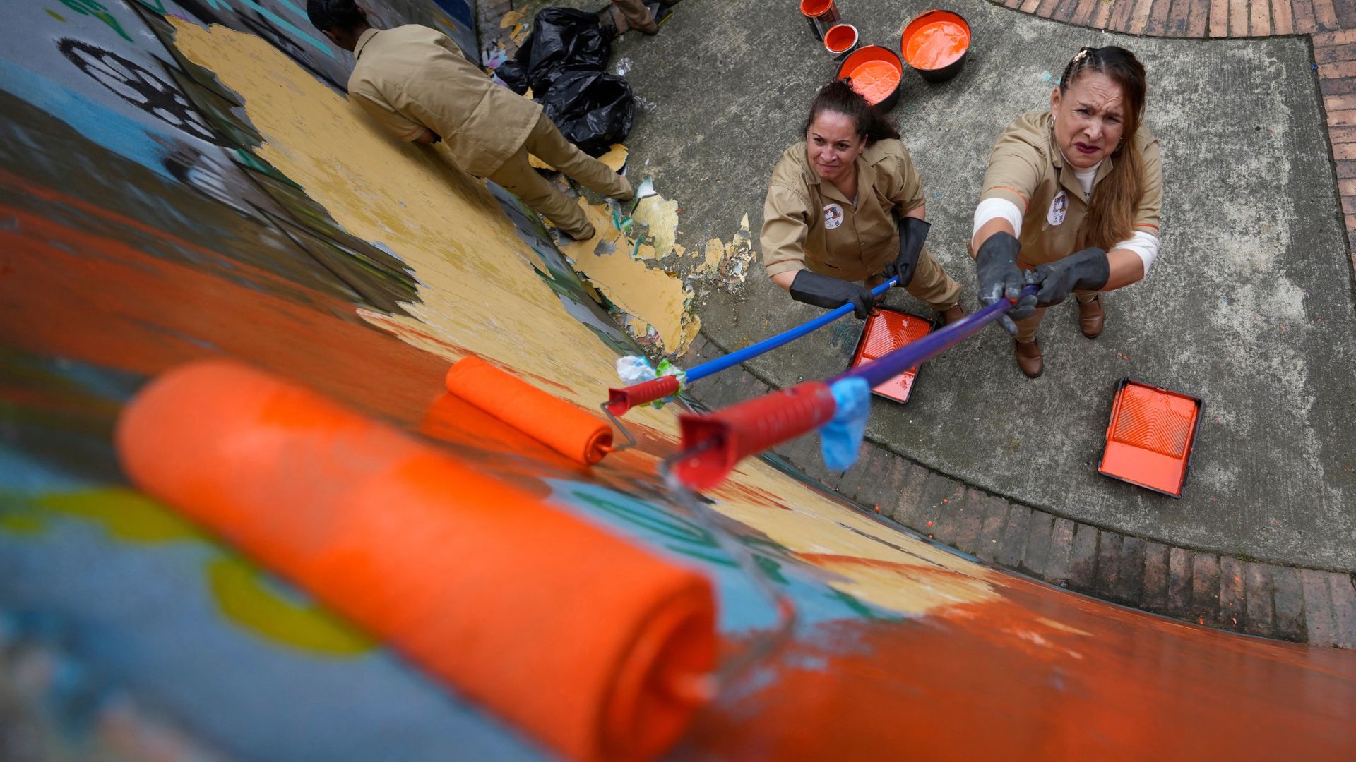 
                                Prison inmates paint a park in Bogotá, Colombia
                            