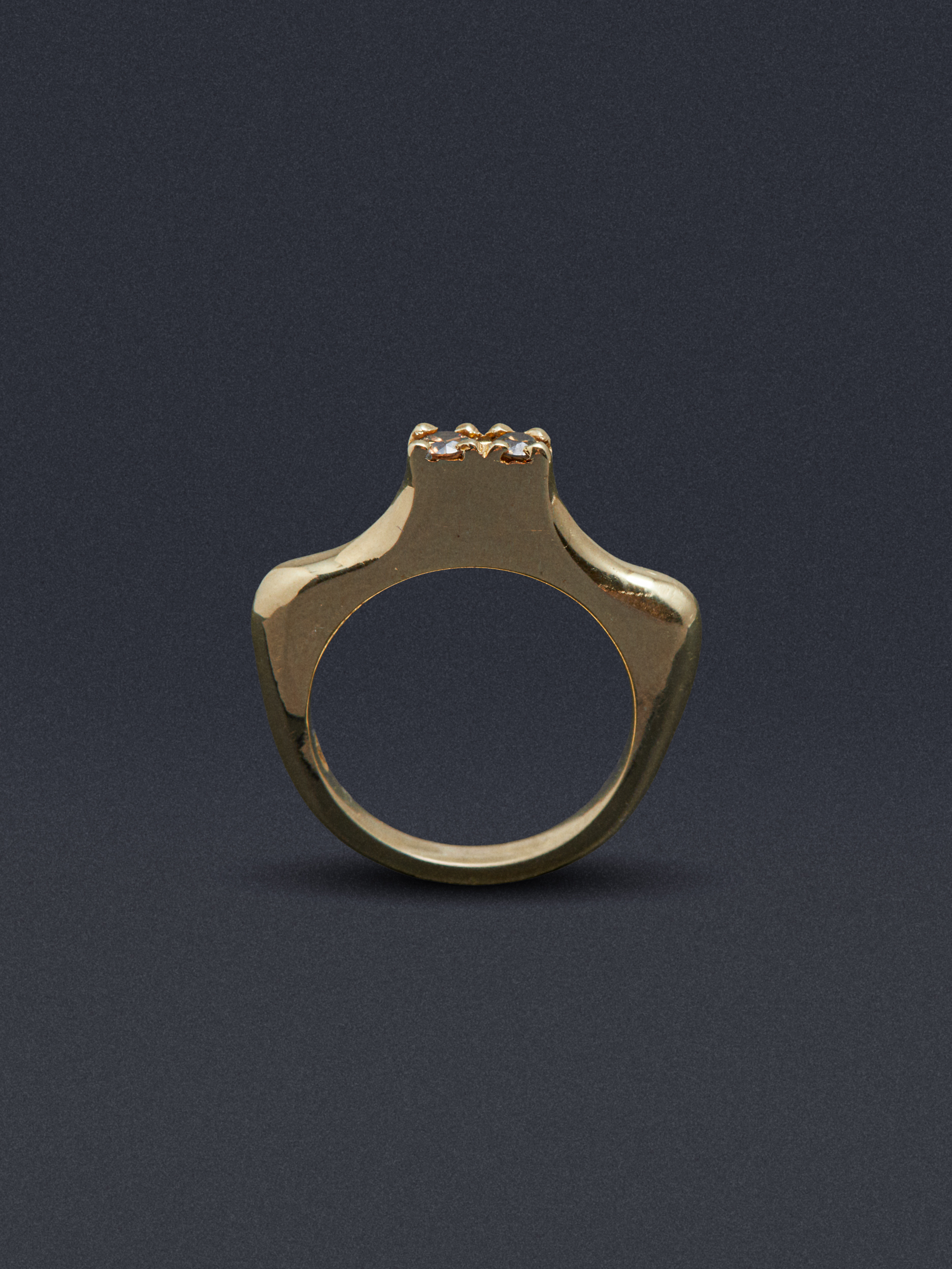 gold and silver jewellery against coloured backgrounds