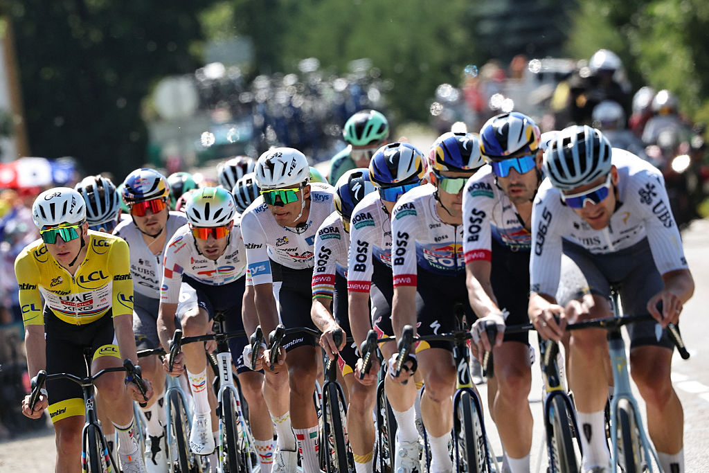 UAE Team Emirates - XRG's Slovenian rider Tadej Pogacar wearing the overall leader's yellow jersey cycles with the pack of riders (peloton) during the 18th stage of the 113th edition of the Tour de France cycling race, 185,2 km between Voiron and Orci&amp;egrave;res-Merlette in the French Alps, on July 23, 2026. (Photo by Anne-Christine POUJOULAT / AFP)