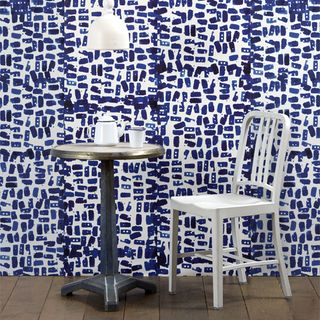 room with blue and white wallpaper