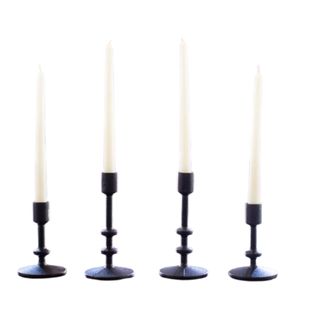 White taper candles in black holders