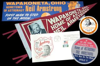 Vintage memorabilia celebrating Neil Armstrong's connection to Ohio and his hometown of Wapakoneta. The first moonwalker’s Ohio accent may have led to his famous first words on the moon being misheard.