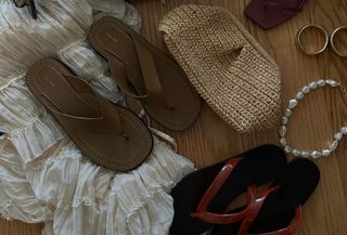 A black raffia clutch, brown heels, tan sandals, red jelly flip flops, a tan raffia clutch, a beaded necklace and gold earrings.
