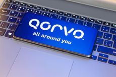  In this photo illustration, the Qorvo Inc. logo is seen displayed on a smartphone screen next to a laptop keyboard. 