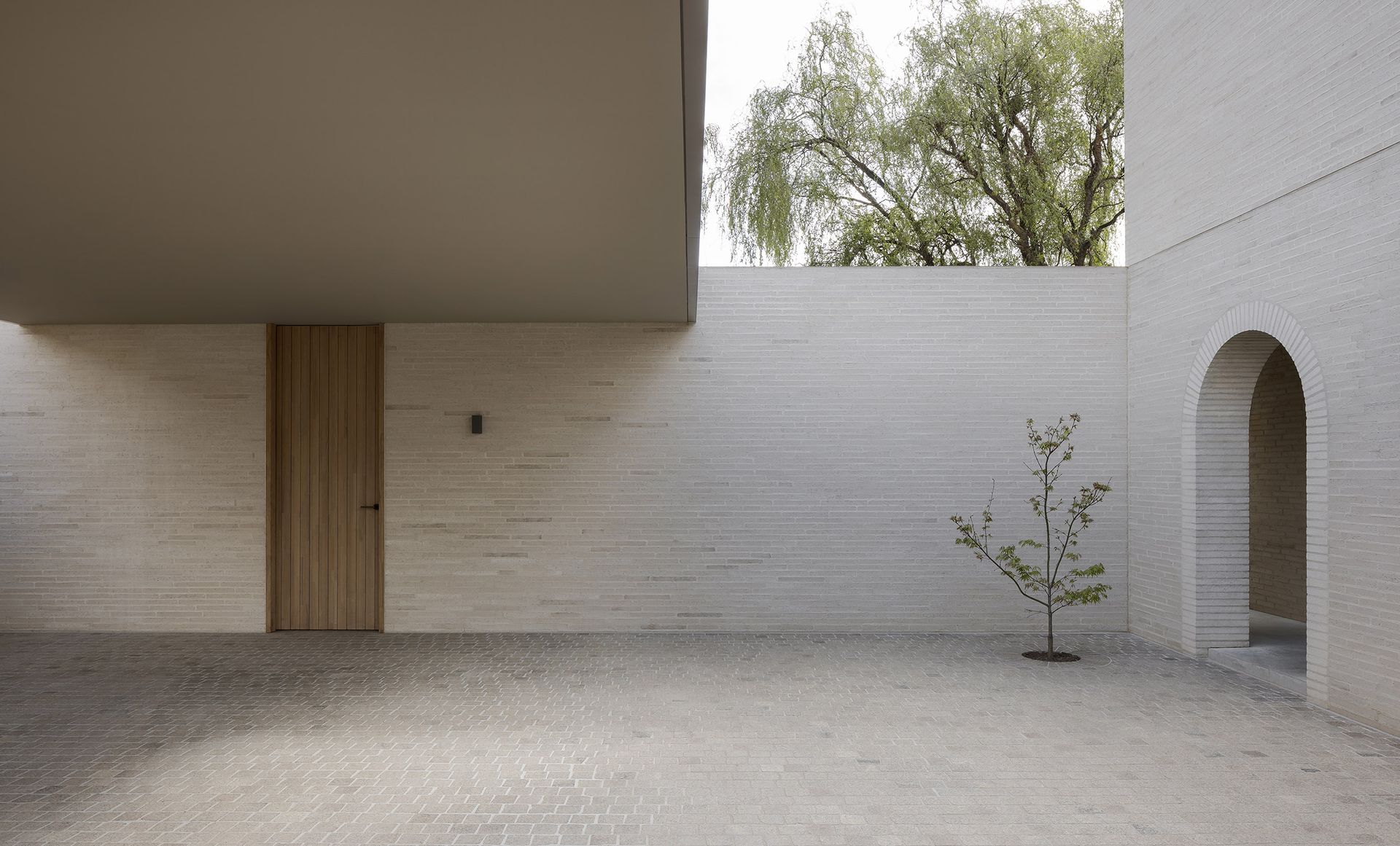 A series of hidden courtyards define this minimalist Melbourne house