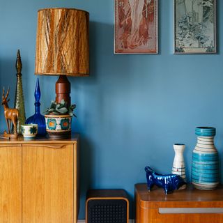 room with blue wall and wooden cabinet