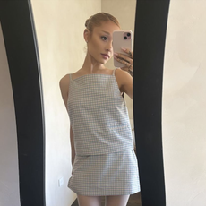 ariana grande wears a gingham skirt set and pink satin pointe ballet flats from sandy liang's spring/summer 2025 collection