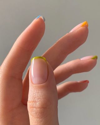 Square nails with multi-coloured pastel French tips