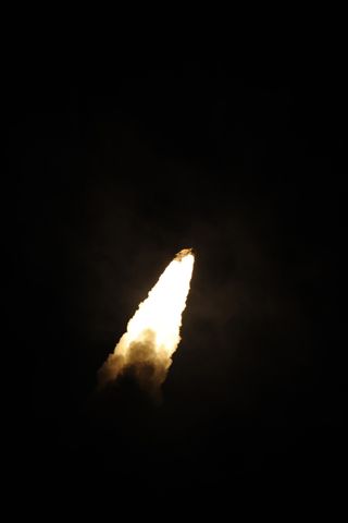 An Ariane 5 rocket carrying the European Space Agency's ATV-3 cargo ship Edoardo Amaldi lights up the night after a dazzling liftoff just after 12 a.m. EDT from Guiana Space Center in Kourou, French Guiana.