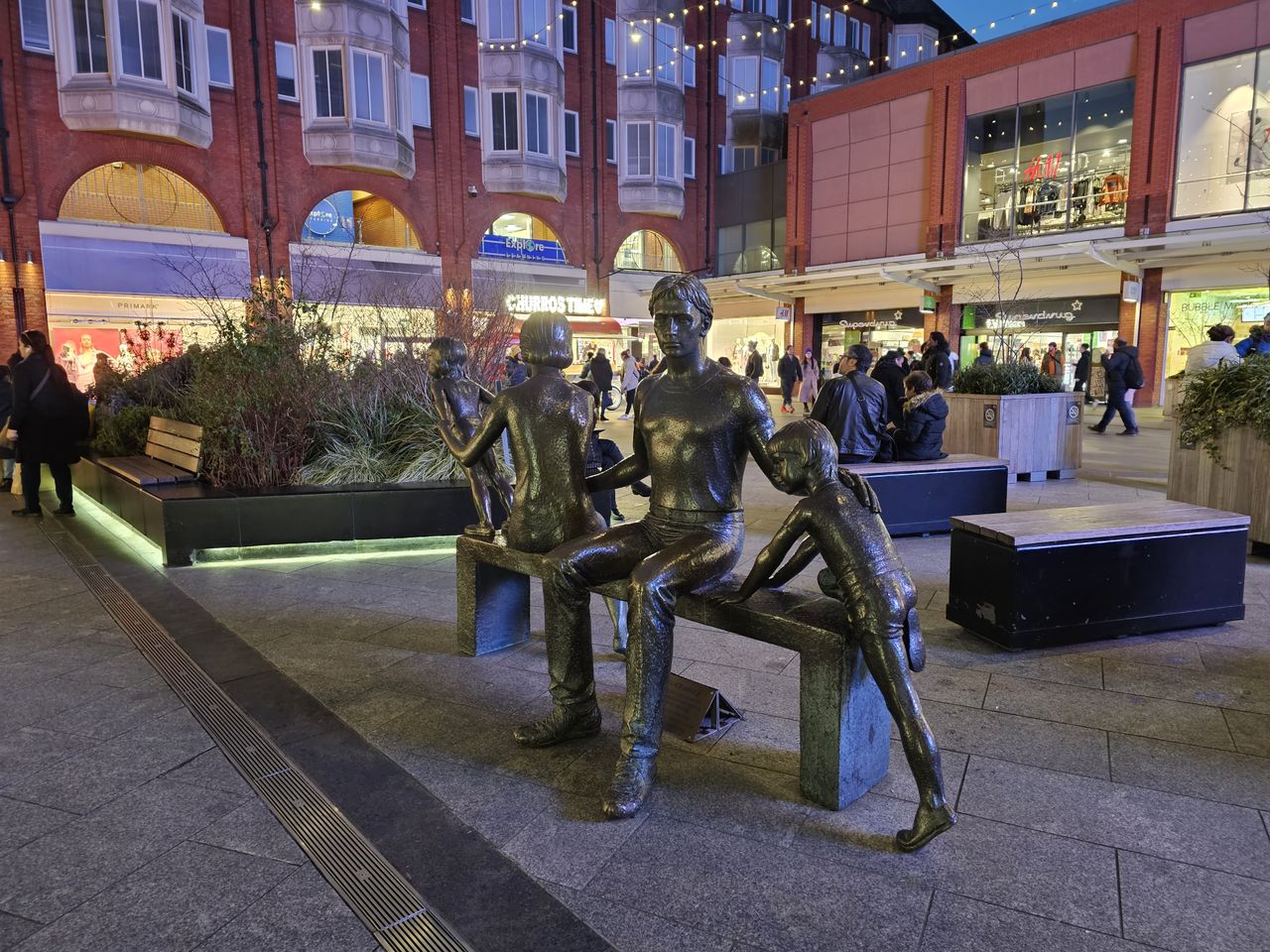 statues of a man and children