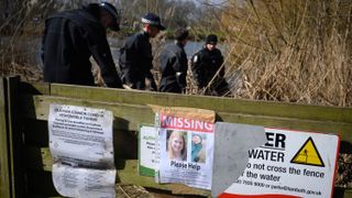 A poster is seen as police search teams work their way through the reeds in Mount Pond on Clapham Common as the hunt for missing woman Sarah Everard enters its fifth day, on March 09, 2021 in London, England.