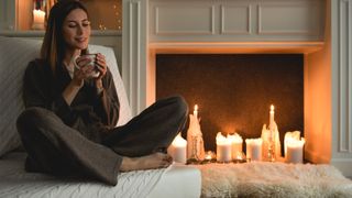 woman sitting in cosy living room