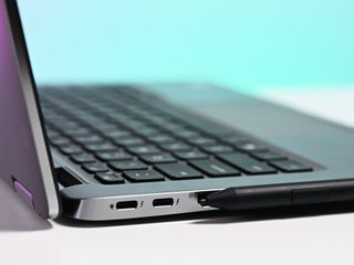 The Premium Active Pen magnetically attached to the Dell Latitude 7400 2-in-1.