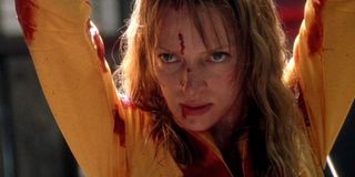 The Bride raises her hands above her head in 'Kill Bill Vol. 1'