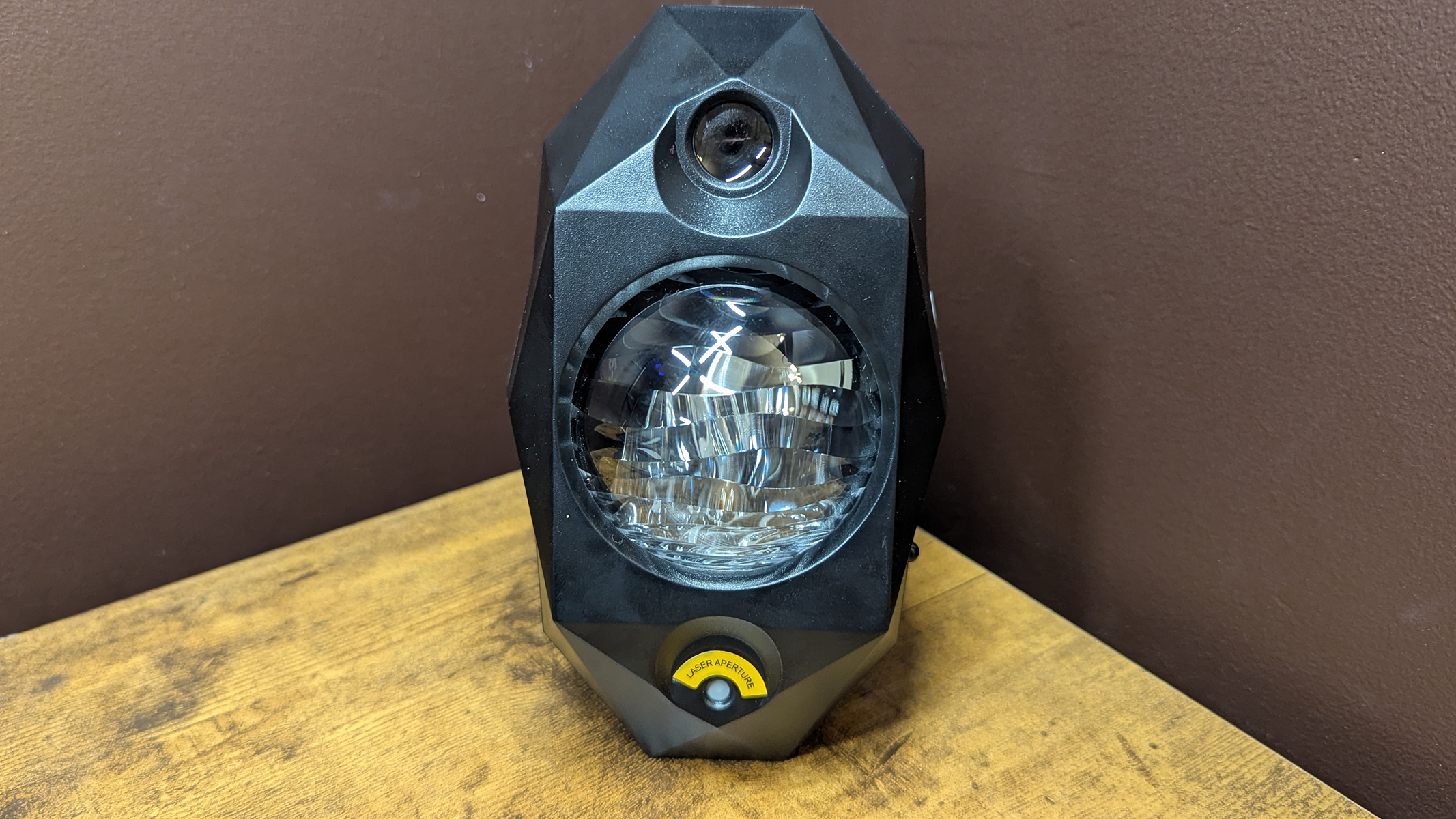 The Cadrim star projector sitting vertically on a wooden table