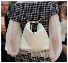 White backpack at Chanel SS25 show in Paris