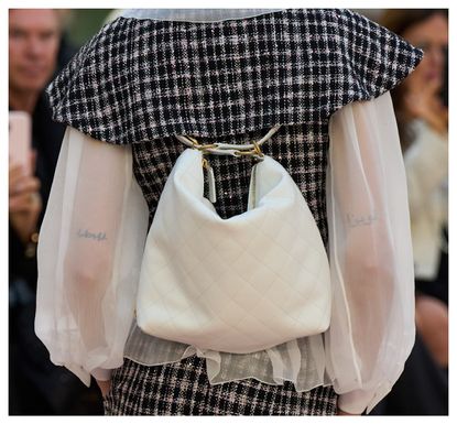 White backpack at Chanel SS25 show in Paris