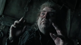 Peter Pettigrew transforms back into human form and talks to Sirius and Remus.