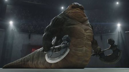 Jeremy Allen White as Rotta the Hutt, holding two axes, in The Mandalorian and Grogu