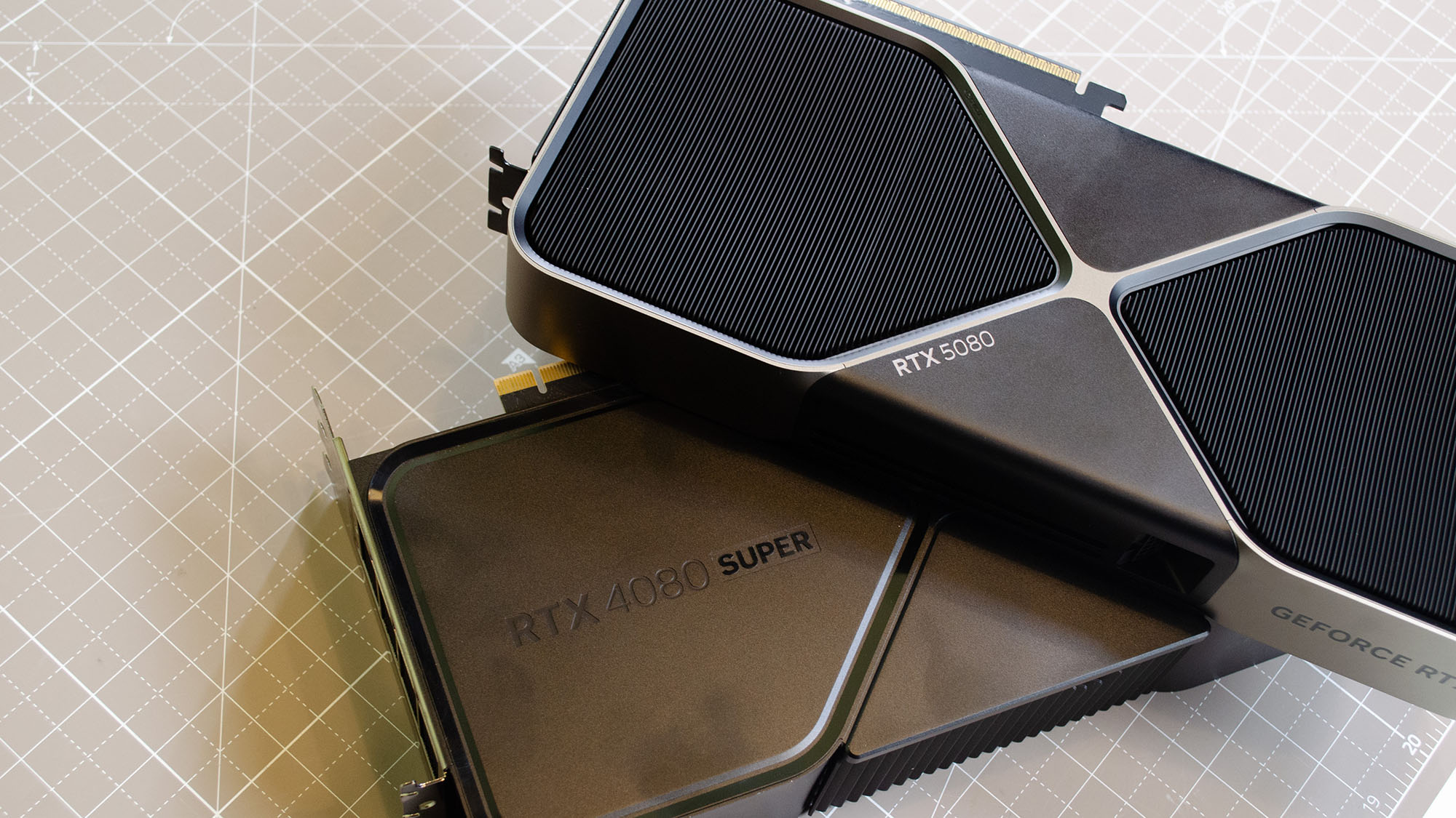 An Nvidia GeForce RTX 5080 resting on an RTX 4080 Super