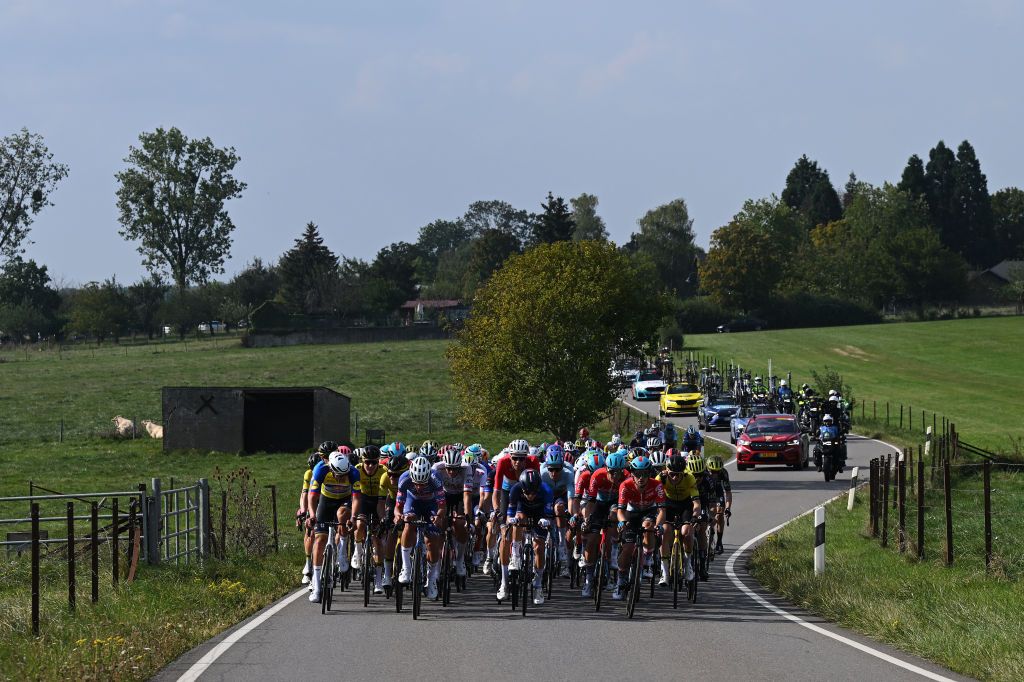 SCHIFFLANGE LUXEMBOURG SEPTEMBER 19 LR Mathieu Van Der Poel of The Netherlands and Team AlpecinDeceuninck Yellow leader jersey Silvan Dillier of Switzerland and Team AlpecinDeceuninck Kevin Geniets of Luxembourg and Team GroupamaFDJ and a general view of the peloton competing during the 84th Tour de Luxembourg 2024 Stage 2 a 155km stage from Junglinster to Schifflange UCIWT on September 19 2024 in Schifflange Luxembourg Photo by Tim de WaeleGetty Images
