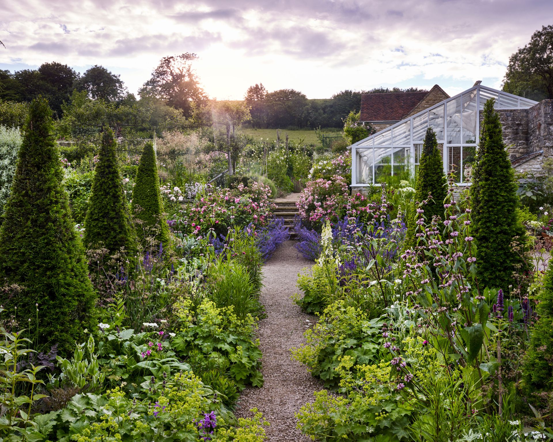 Naturalistic planting design in the yew borders at Batcombe House by Libby Russelle
