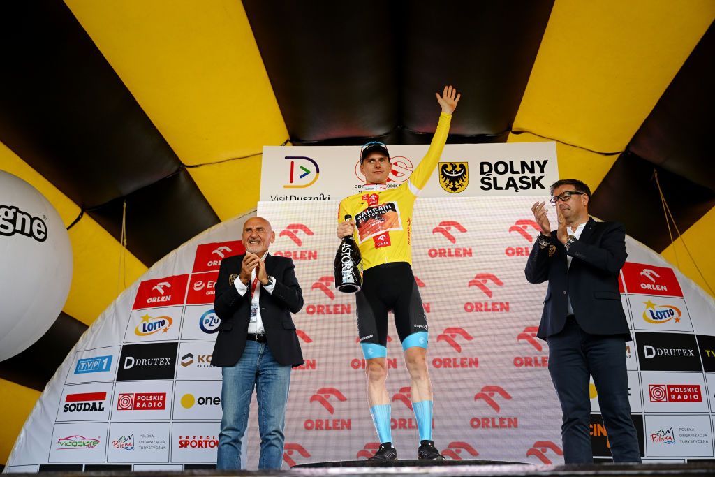 DUSZNIKIZDROJ POLAND JULY 31 Matej Mohori of Slovenia and Team Bahrain Victorious celebrates at podium as Yellow leader jersey winner during the 80th Tour de Pologne 2023 Stage 3 a 1623km stage from Walbrzych to DusznikiZdroj 668m UCIWT on July 31 2023 in DusznikiZdroj Poland Photo by Dario BelingheriGetty Images