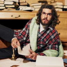 Andrew Garfield wears a plaid shirt while posing for a Who What Wear photo shoot