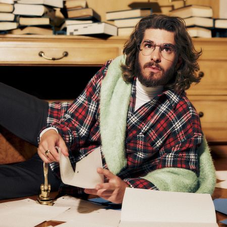 Andrew Garfield wears a plaid shirt while posing for a Who What Wear photo shoot