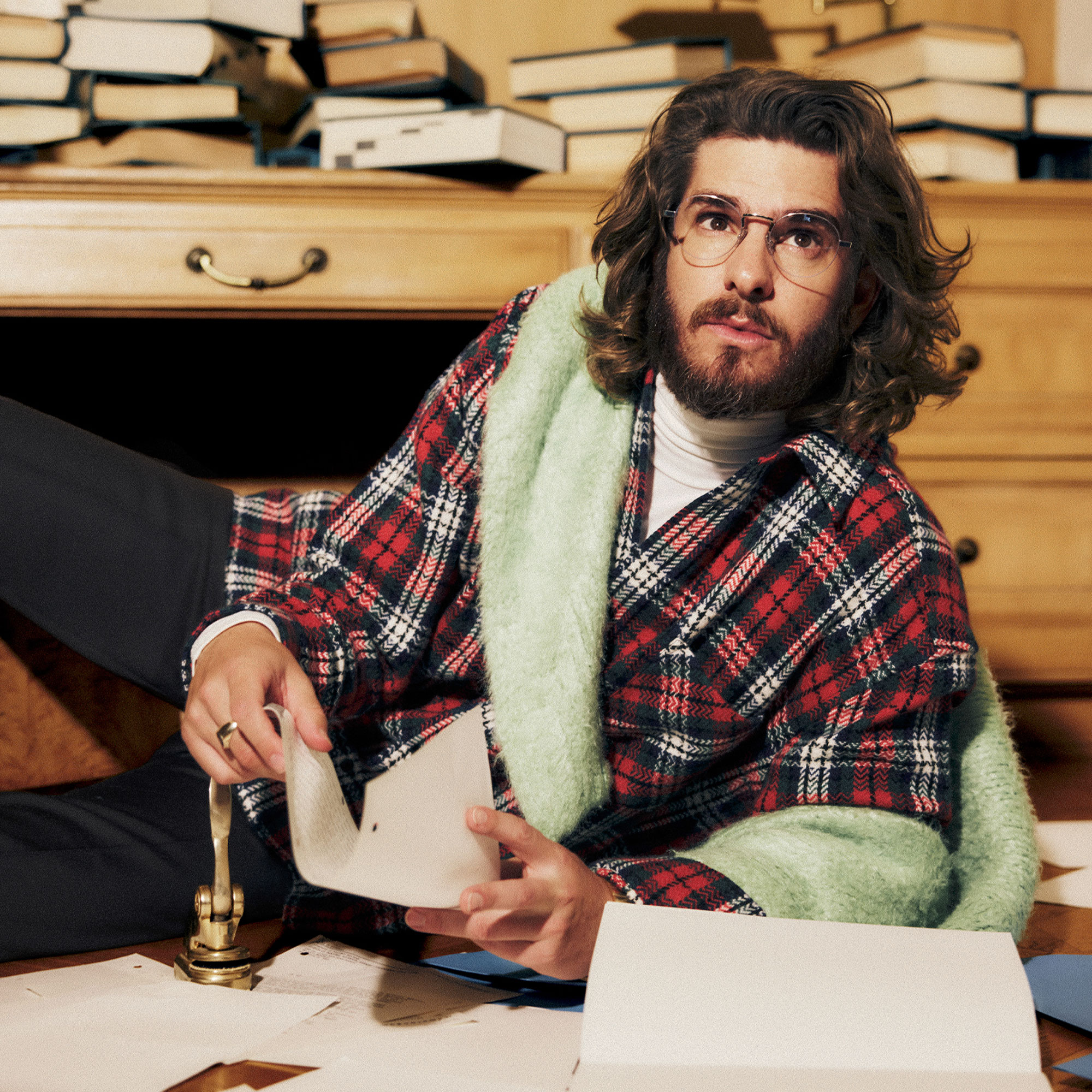 Andrew Garfield wears a plaid shirt while posing for a Who What Wear photo shoot