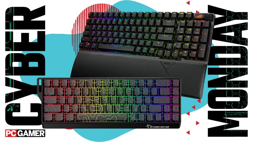 Two RGB gaming keyboards on a blue and red Cyber Monday background