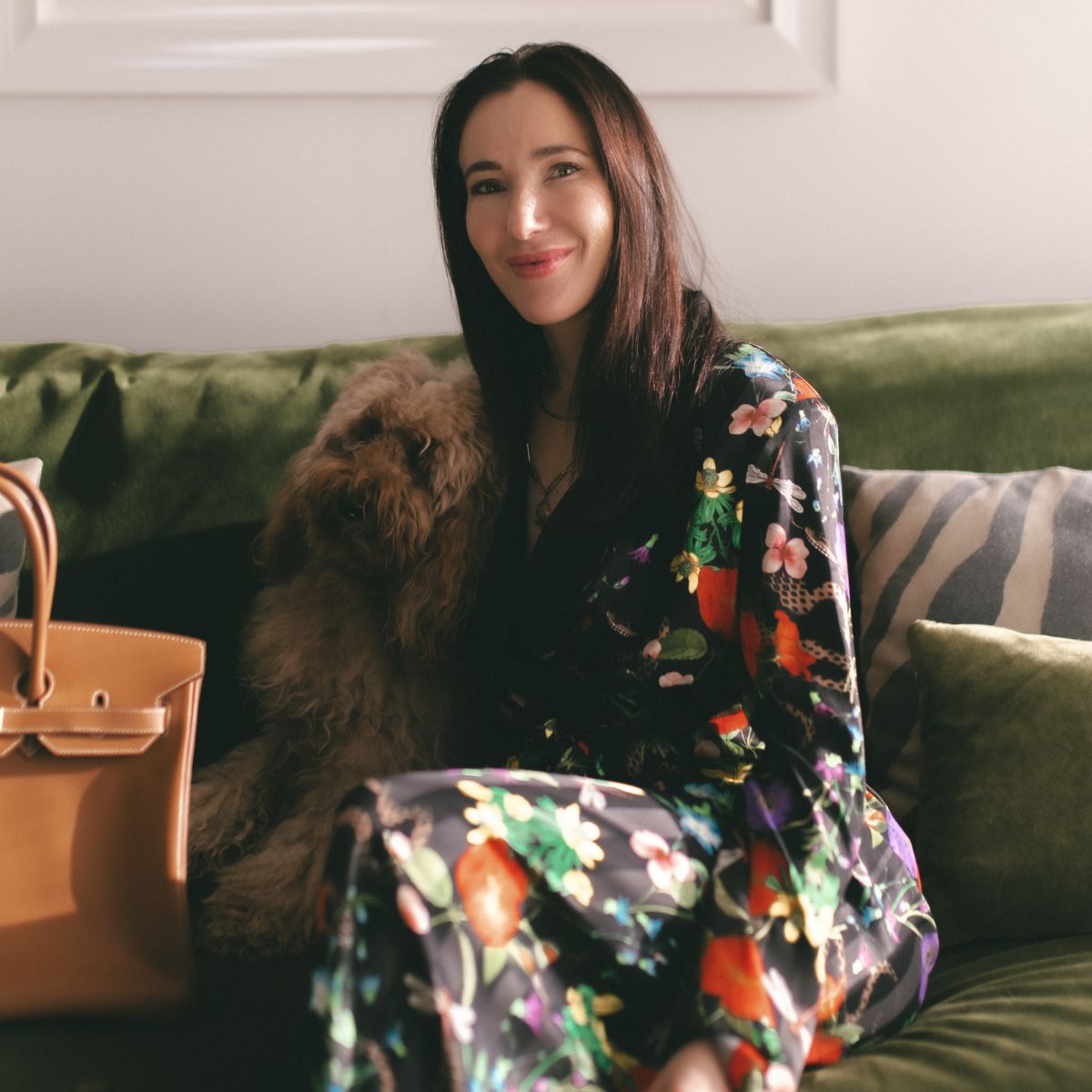 sign of the times ceo antonia johnstone with her dog and a brown hermes bag