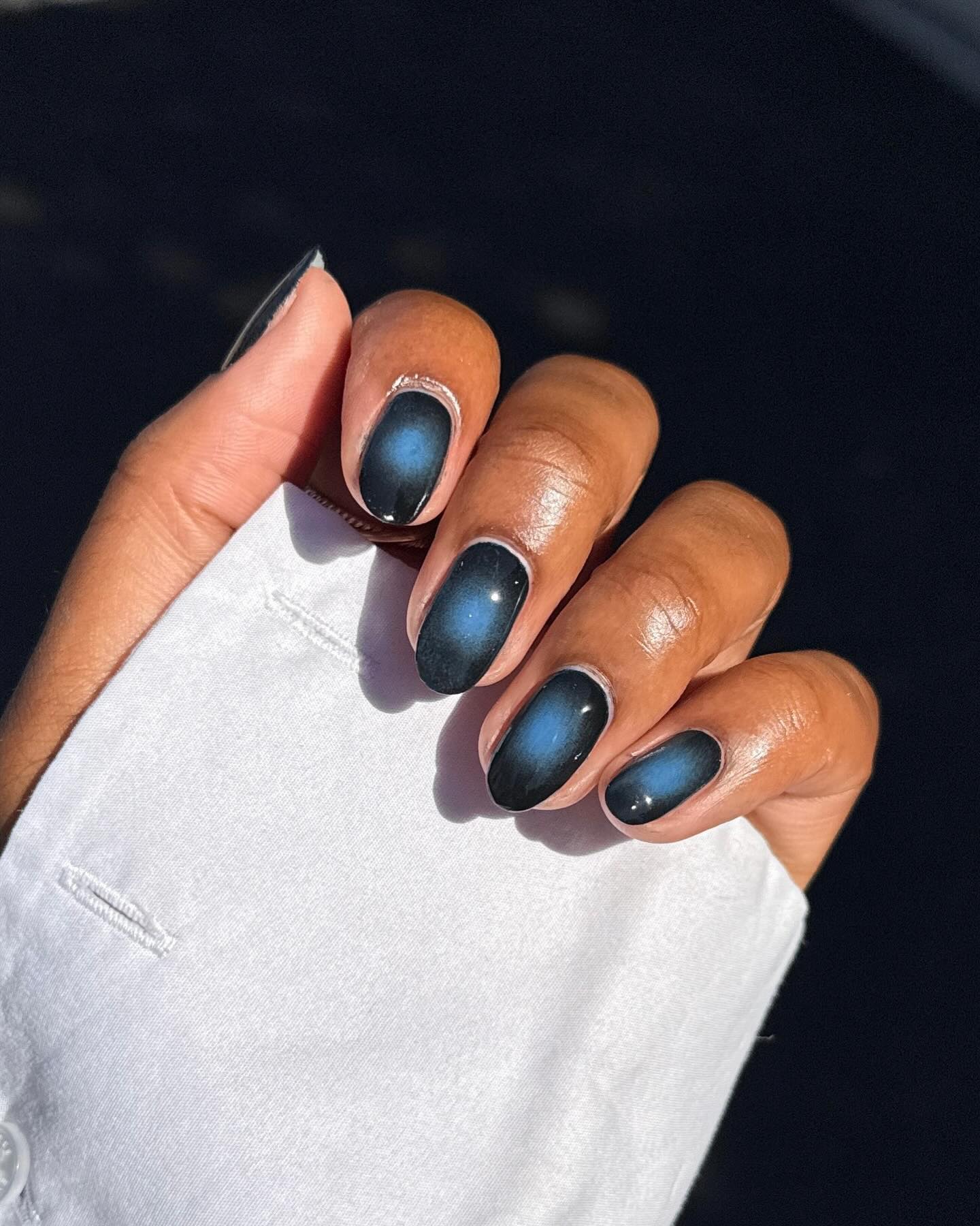 Black nail polish manicure design.