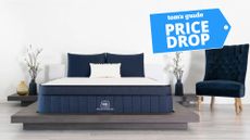 Brooklyn Bedding Aurora Luxe navy and white mattress on wooden bed base in bedroom with grey wooden floor and Tom's Guide price drop badge