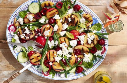 Grilled peach salad with feta, bacon and green beans on large sharing platter