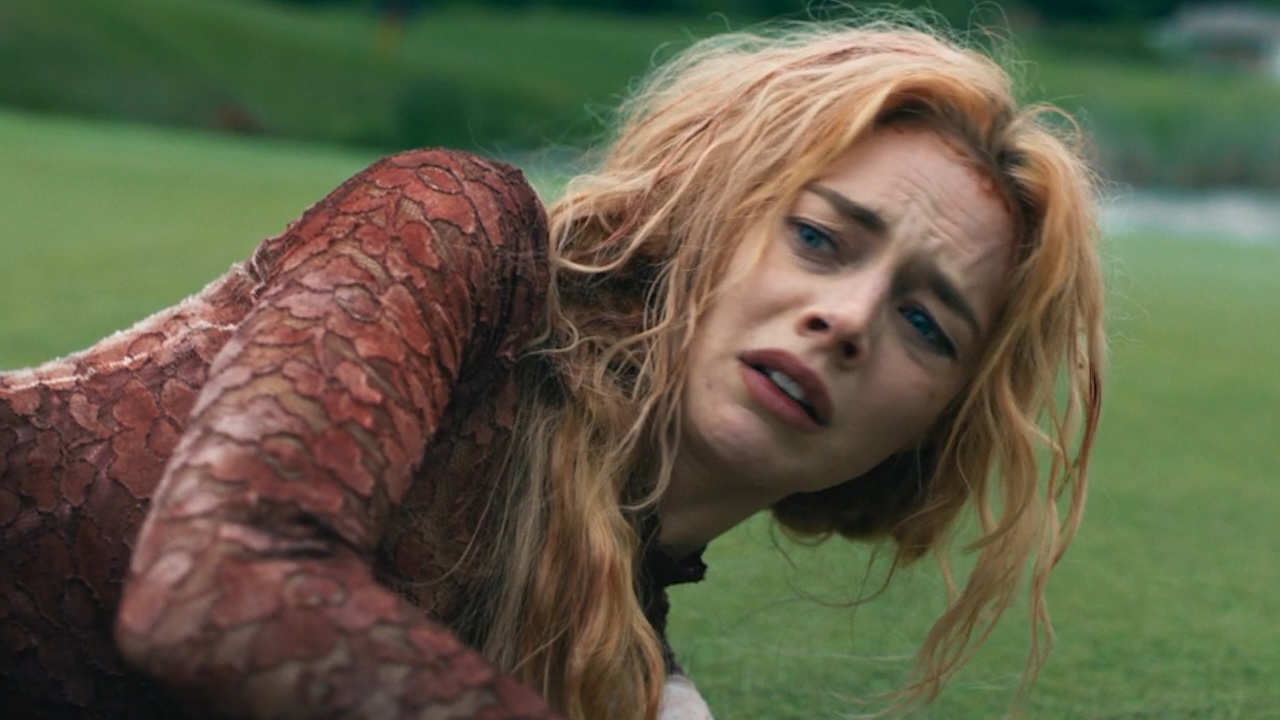 Grace in Ready or Not 2 looking scared and tired in a bloody dress. 