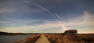 Photographer Chris Bakely captured this stunning view of a Minotaur 1 rocket streaking over Cape May, N.J., during the ORS-3 launch of 29 small satellites from NASA's Wallops Flight Facility on Wallops Island, Va., on Nov. 19, 2013.