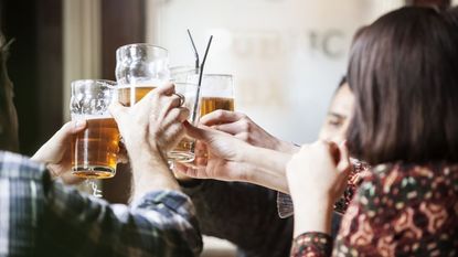 Group of people drinking beer in a pub