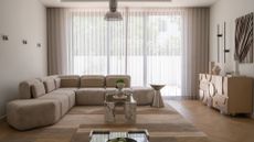 A minimalist living room with a rounded beige sectional a marble and glass coffee table, a steel side table, a wood and silver sideboard, a set of three chrome sconces, and a geometric rug
