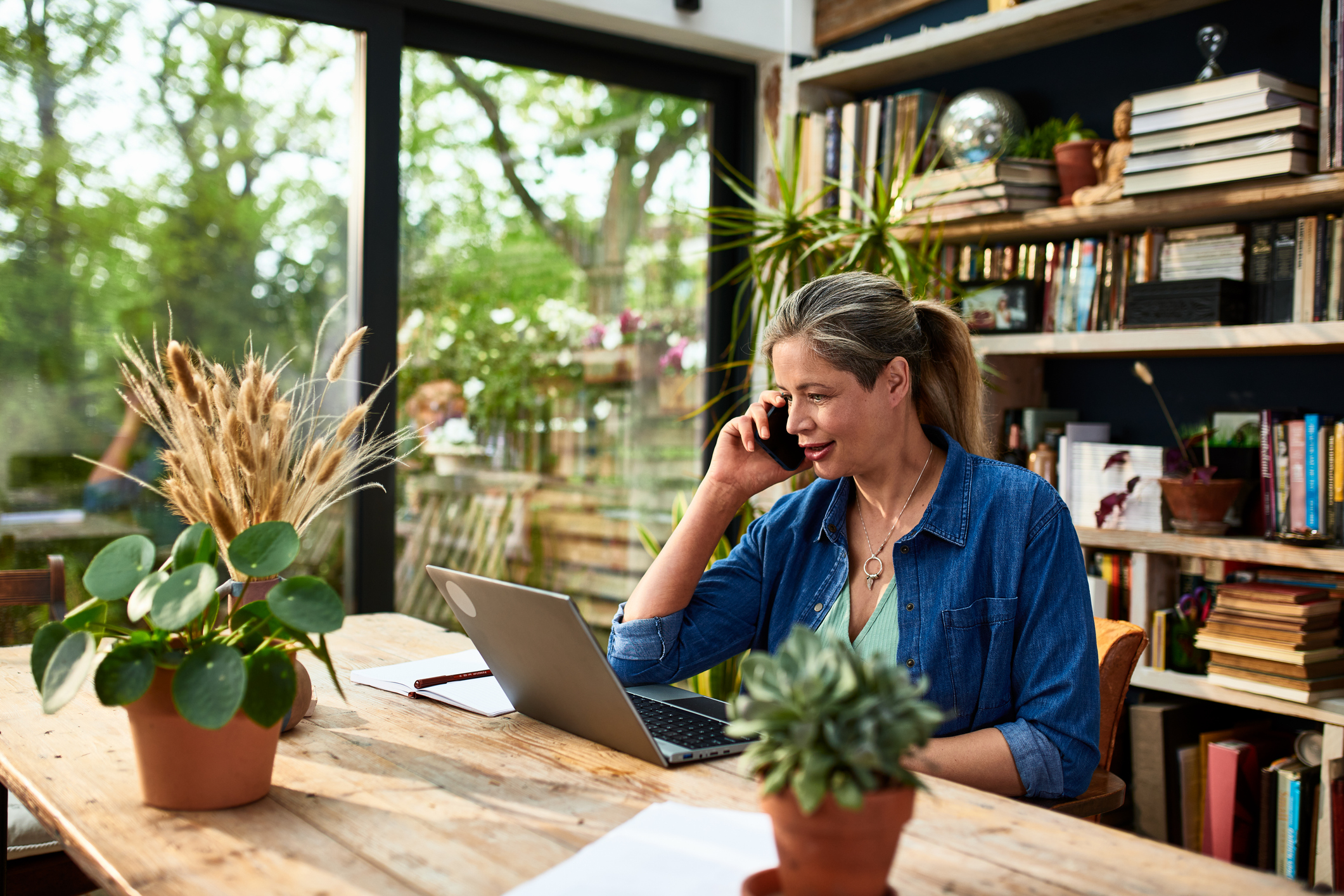 Woman using smartphone and remote working