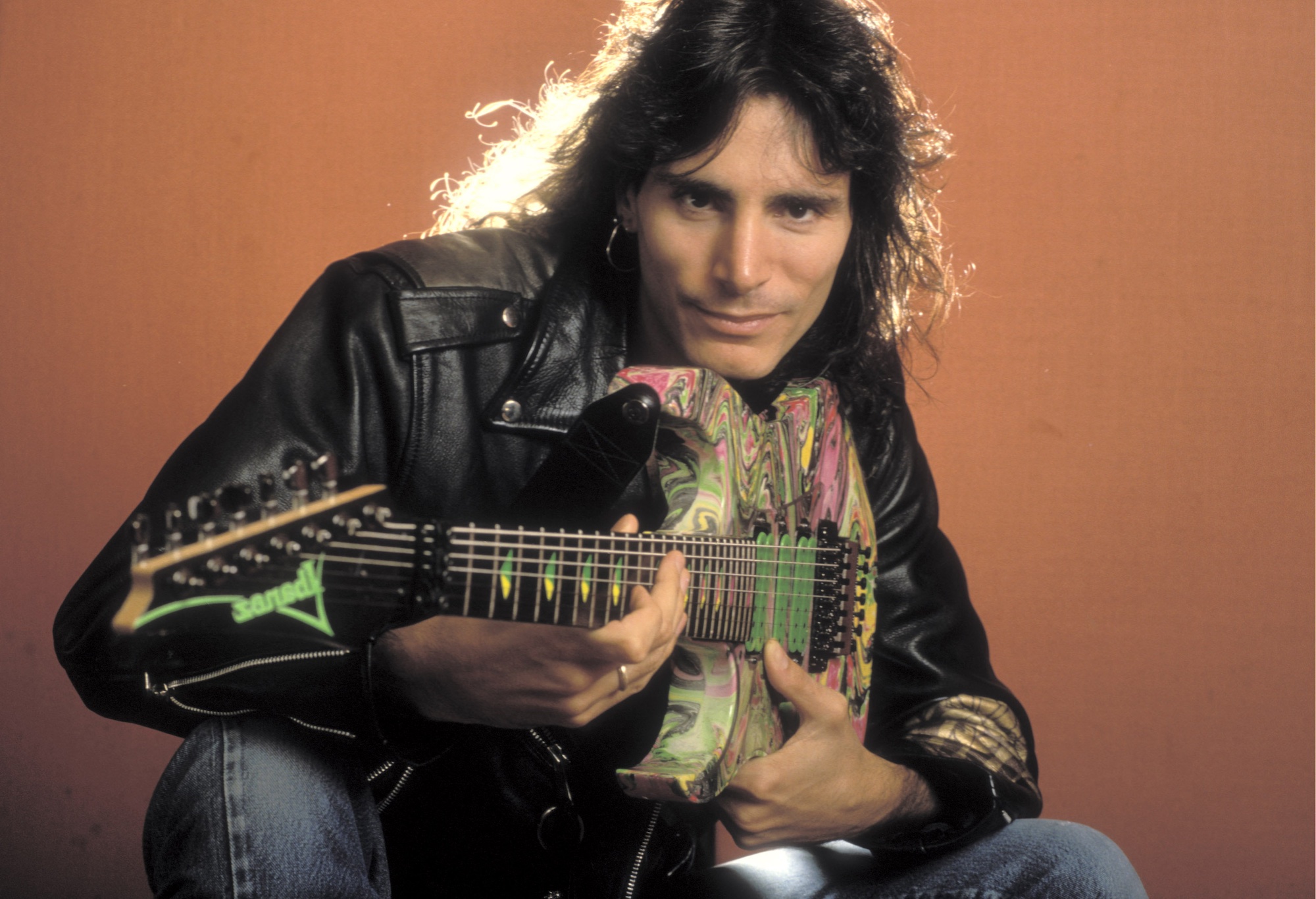 Steve Vai poses with his colorful Ibanez in Amsterdam, Netherlands on April 24, 1990