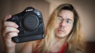 Photographer James Artaius holding a Canon EOS R1